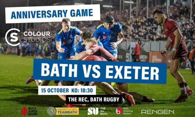Two University of Bath rugby players, wearing blue, run to support a maul. Behind them is a packed stand of spectators at The Rec, sitting underneath floodlights. Over the image is text saying: "Anniversary Game. Bath vs Exeter. 15 October. KO 18:30. The Rec, Bath Rugby."