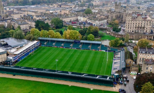 An aerial view of The Rec, home of Bath Rugby, with Bath city centre in the background including Bath Abbey, Parade Gardens and Empire Hotel.