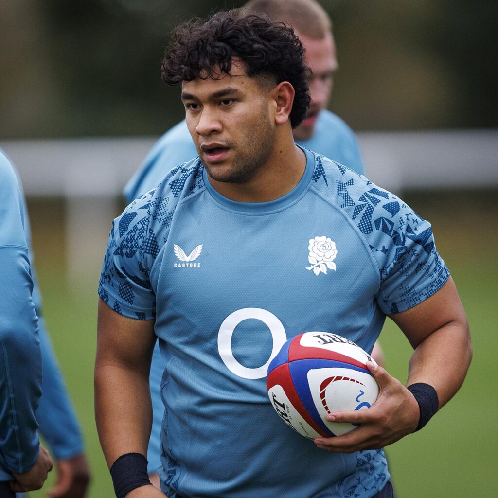 England Rugby A player Kepu Tuipuloto holding a ball in his left hand during training.