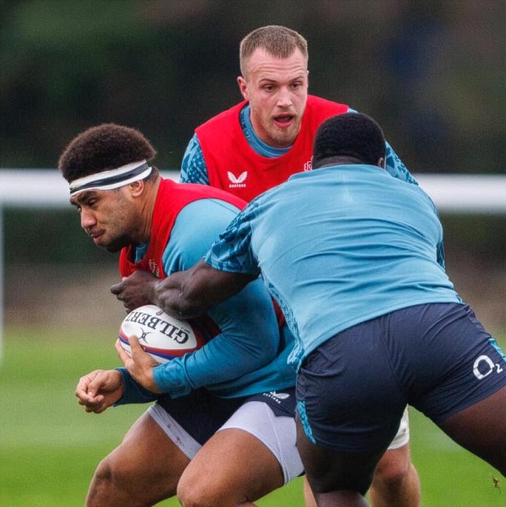 Rugby player Billy Sela is tackled by a team-mate during an England Rugby Men A training session at the University of Bath.