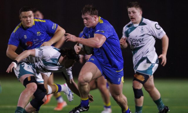 University of Bath prop Claudius Wheeler running with the ball past an attempted tackle