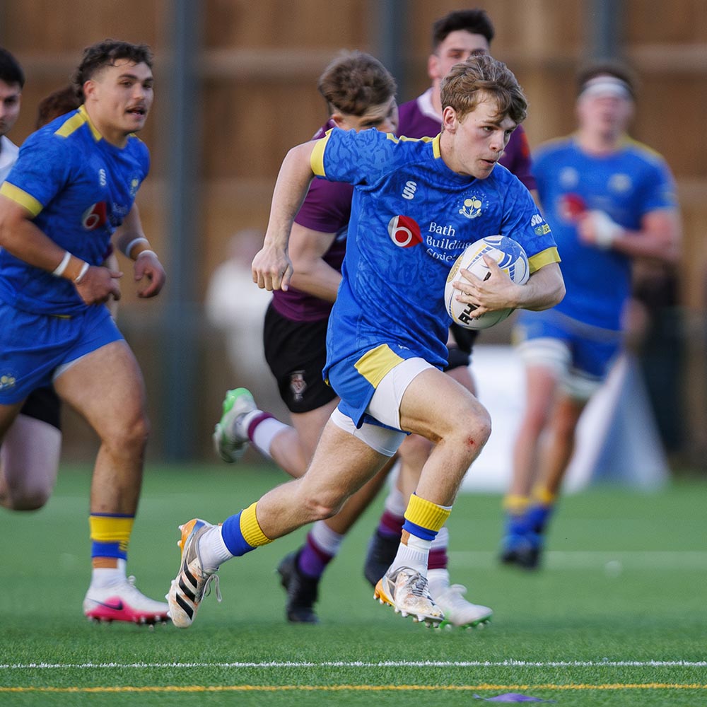 Isaac Mears runs through to score a try for the University of Bath men's 1st XV